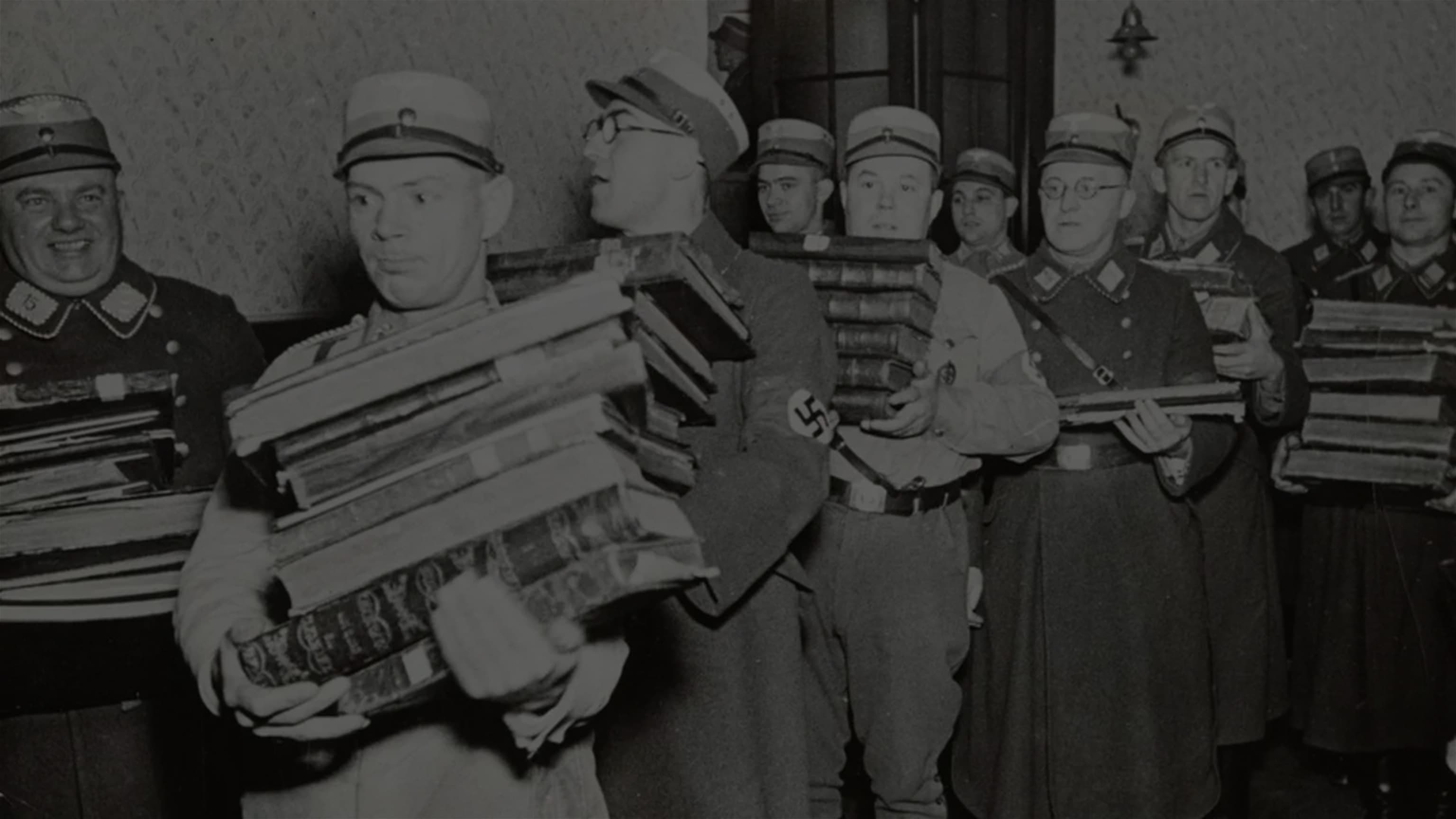 Nazi officers carrying away books, presumably to be burned